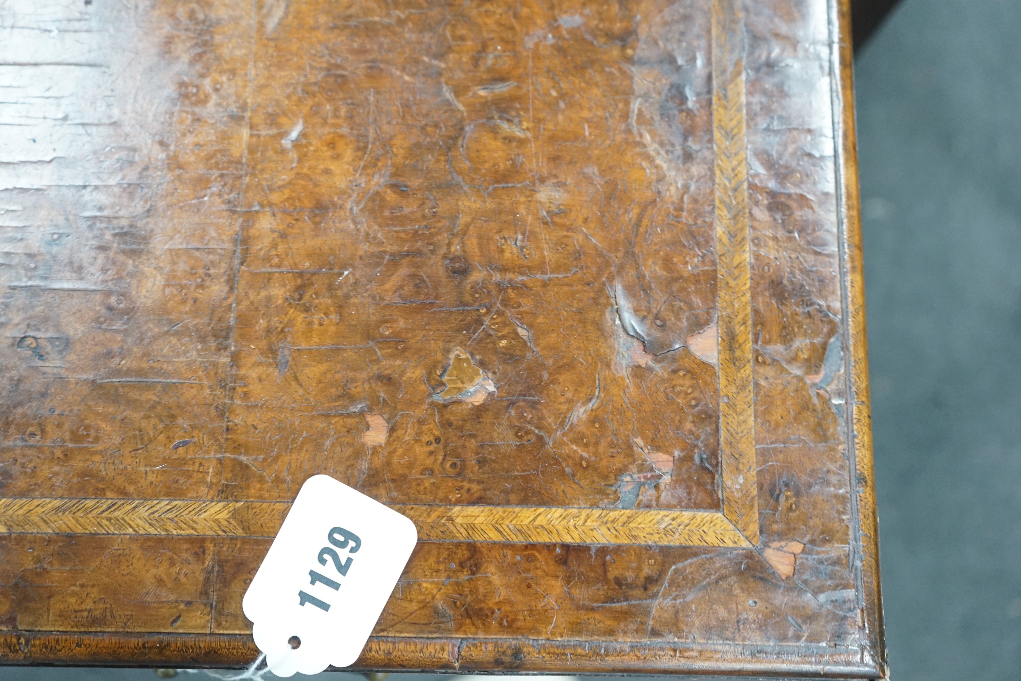 An early 18th century style feather banded walnut bachelor's chest, width 76cm, depth 34cm, height 75cm